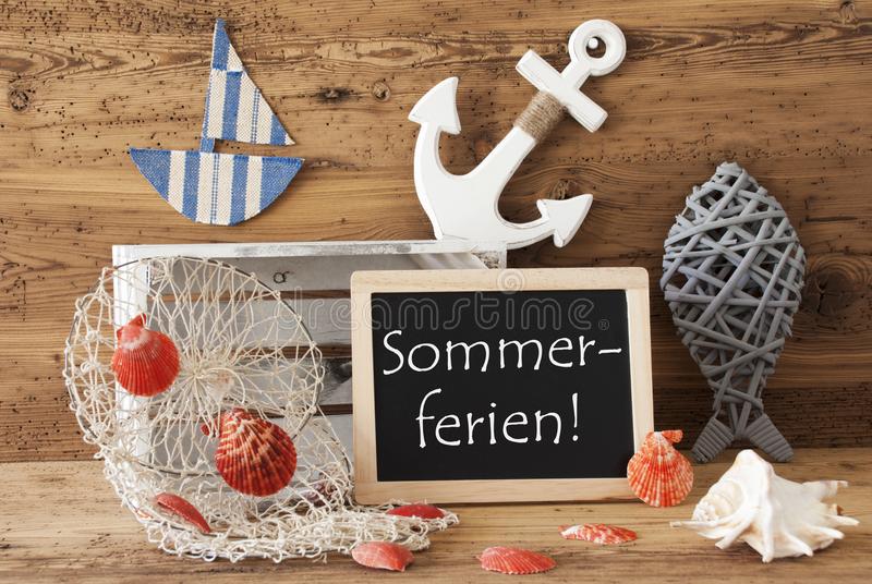 blackboard_nautical_summer_decoration_wooden_background_german_text_sommerferien_means_summer_holidays_fish_anchor_shells_116830813.jpg